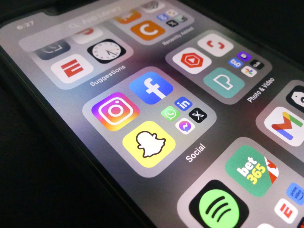 Close-up view of a smartphone screen featuring popular social media application icons. — 5 Simple Ways to Get More Instagram