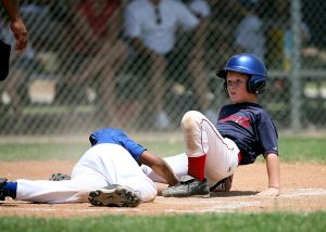 Young baseball players in action during an intense game at a sunlit field. — A Complete Guide to Watching NBA Games on nbabit