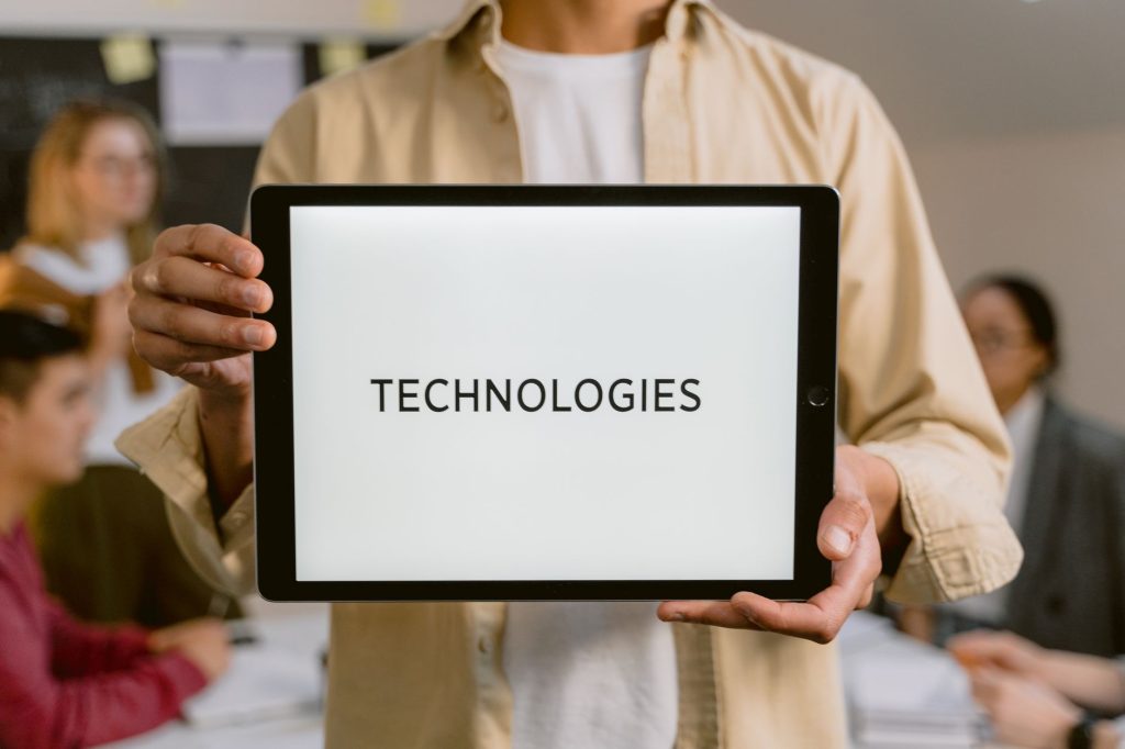 Business professionals discussing technologies, shown on a tablet in an office setting. — A quick guide to SEO: