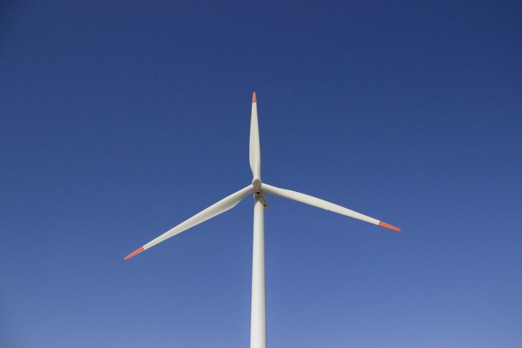 A wind turbine set against a clear blue sky, symbolizing clean and renewable energy. — Best Practices for Creating the Best W