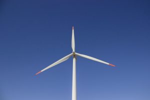 A wind turbine set against a clear blue sky, symbolizing clean and renewable energy. — Best Practices for Creating the Best W