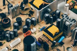 Detailed shot of capacitors and resistors on a circuit board, showcasing modern technology. — Get acknowledge Finding selling
