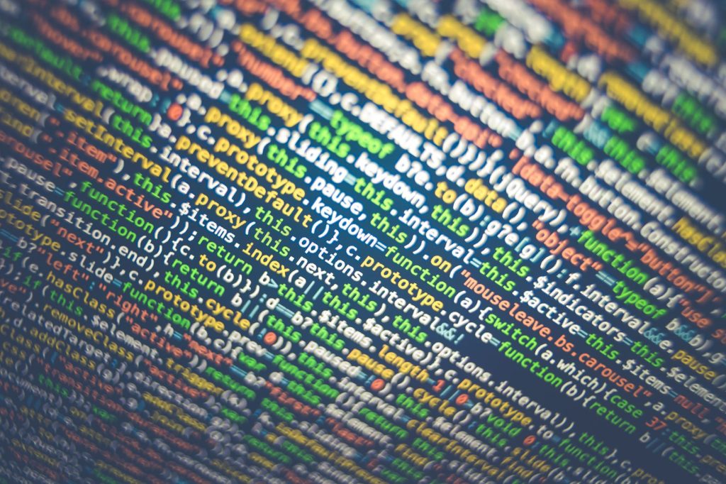 Vibrant multicolored source code displayed on a computer screen, depicting programming and web development concepts. — Law So