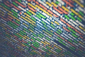 Vibrant multicolored source code displayed on a computer screen, depicting programming and web development concepts. — Law So