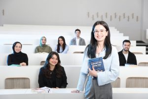 Group of diverse university students in a bright lecture hall, studying language education. — The Impact of Digital Marketing