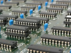 Detailed macro shot showcasing integrated circuits and components on electronic motherboard. — What's a digital Radon Detecto